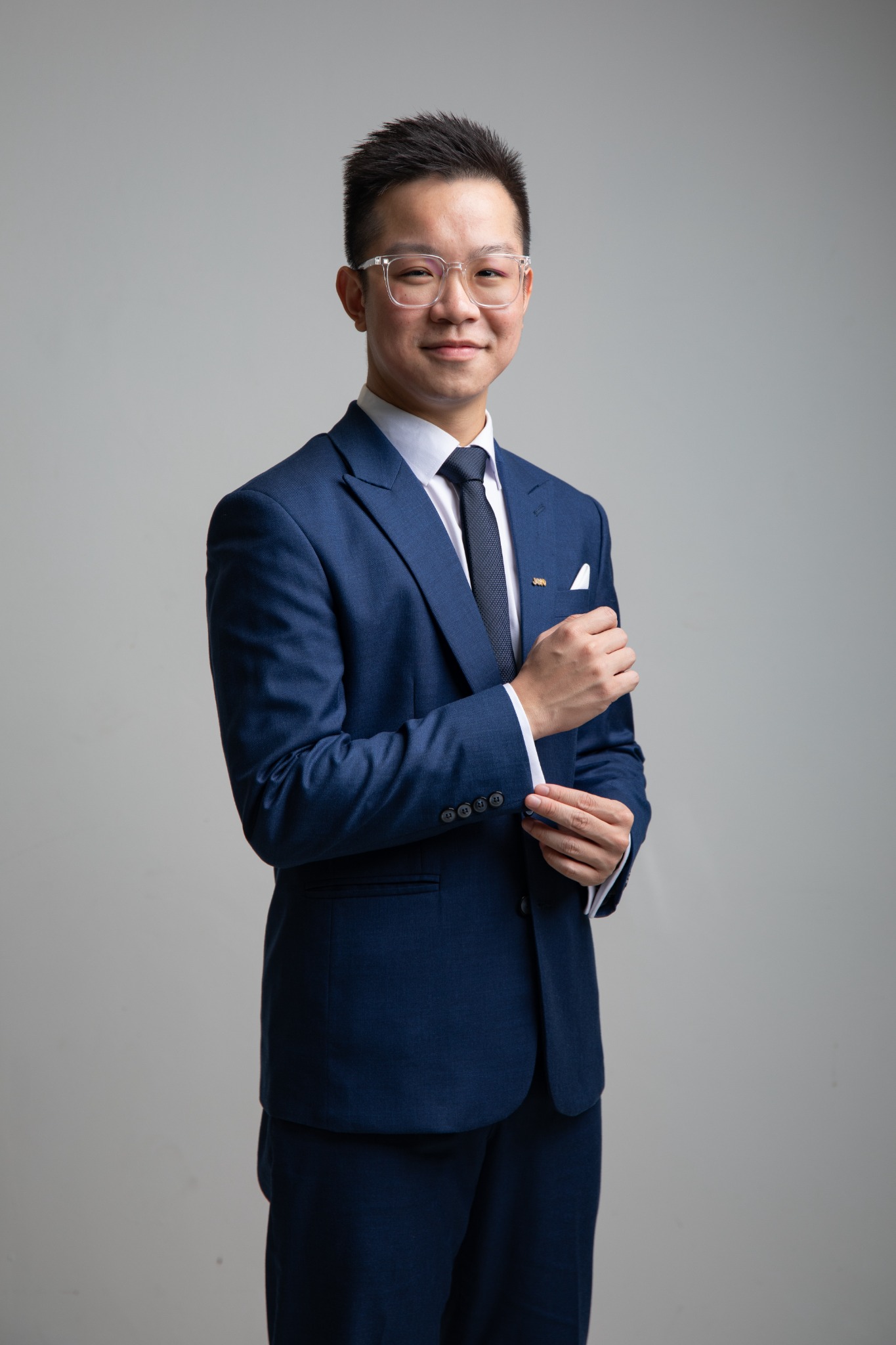 Chua Qin Peng in a navy suit